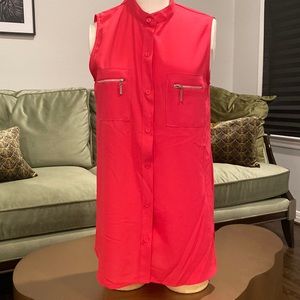 Hot pink sleeveless blouse with super pockets and buttons all the way down